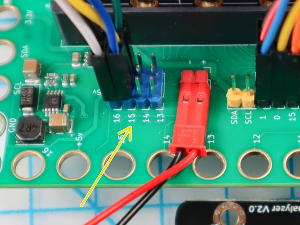 Plug the other end of the jumper wires into the Bit Board at Pin 15 as shown, matching the power, ground, and signal pins.