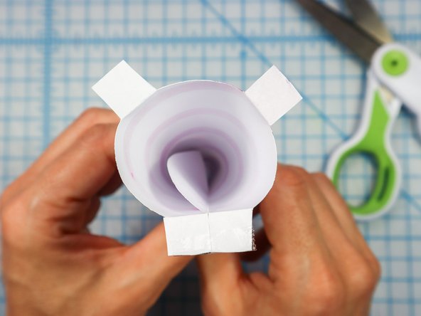 Fold the 3 flaps down as shown.