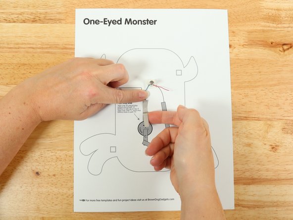 Add Tape Path A. pressing it down atop the blue wire.