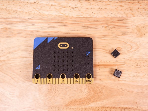 Insert the legs of the buttons through the slots for the A and B buttons on the 3D Printed Micro:Bit.