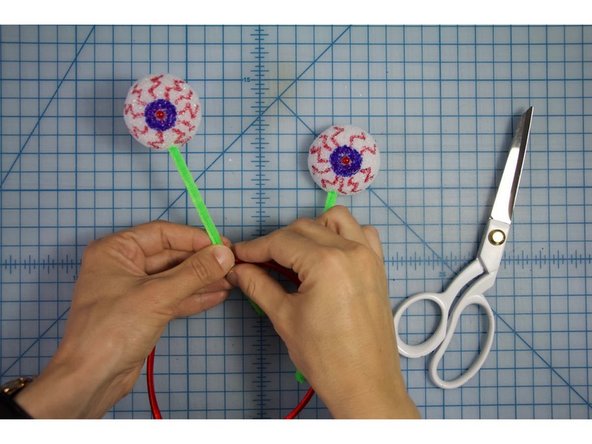 Twist the other ends of the pipe cleaners around the headband.