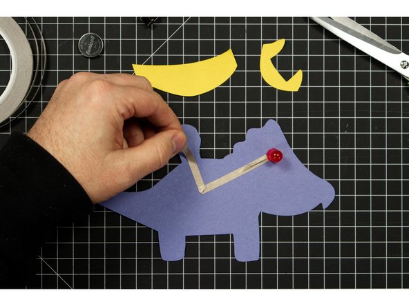 Run a piece of tape along the front of your Triceratops, covering the negative LED leg.