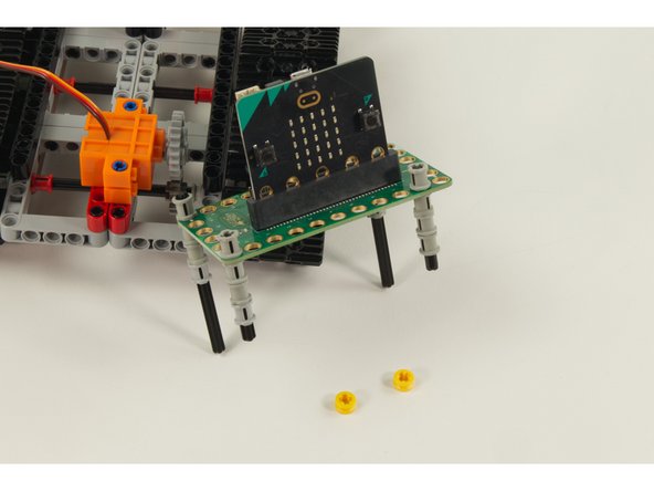 Repeat using a second LEGO Axle 8 and 3 more LEGO Bushing parts.