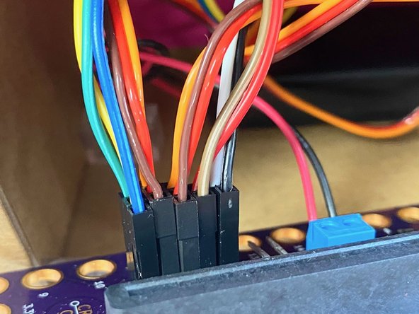 We put the end of the armature wire into the LEGO beam so that the servo would turn both of the eyes.