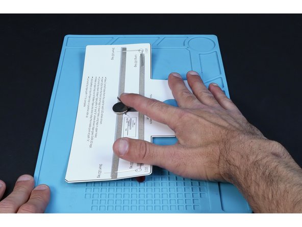 Peel and stick the final Maker Tape pathway where pictured. Sticking it to the top of the battery will turn the LEDs on the opposite side ON, while peeling it back will turn the LEDs OFF.