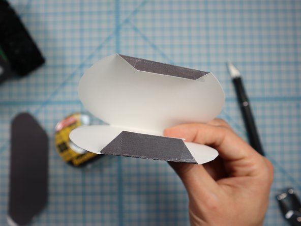Stick double-sided tape or glue to the bottom of the head flaps.