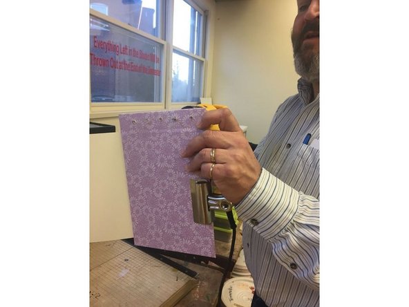 Place five dots where you would like to drill holes through the paper and drill holes through them.