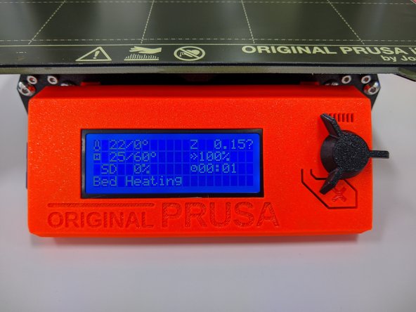 The screen will return to the information display screen and you will see the text, &quot;Bed Heating&quot; displayed at the bottom.  You can watch the bed heat to the appropriate temperature and then the hotend will heat next.