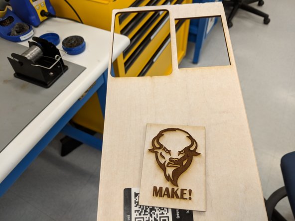 Lift the lid and remove the design, making sure to be aware of the cutting head and the fact that your design is no longer attached to the larger piece of material.