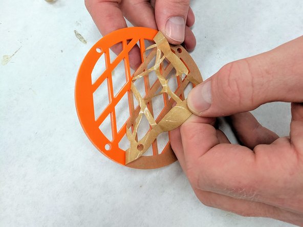 (16)Choose two laser cut, acrylic grilles from the supply provided.  Remove the protective paper from both sides of the grilles.