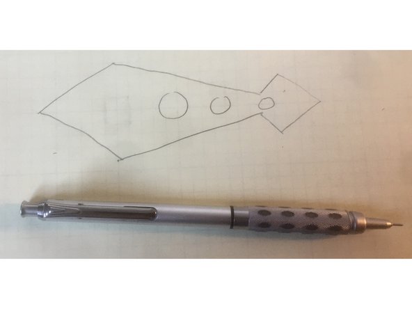 We are going to make a diamond shaped pointer with some circles down the axis as shown in the figure below.  This was my rough sketch drawn on engineering paper to get an idea of what I wanted.