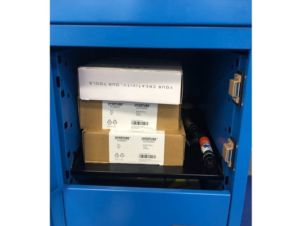 Once the filament has been fully ejected from the extruder head, swap the old spool with the desired spool.