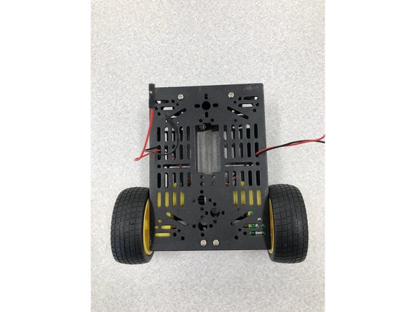 Put the chassis top onto the cart and screw it closed. (Required parts: 1, 9)