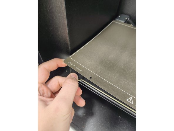 Once you have removed your print and all remaining filament from the print surface you should return the print surface to the printer.