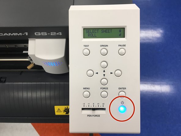 Turn the vinyl cutter on by pressing the power button.  It will illuminate blue.