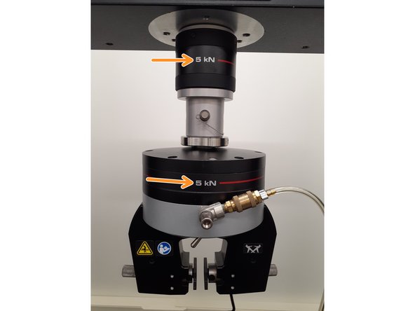 Verify the load cell and grips on the Instron are labeled to have a 5kN load limit. If this is not the case or if another grip type is desired, please ask the Lab Director.