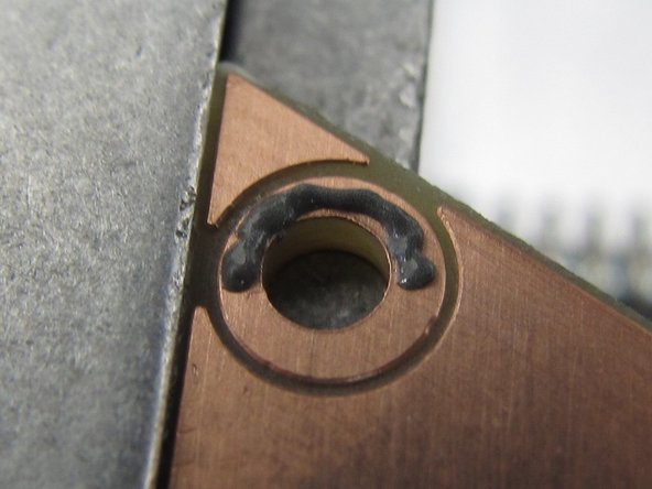 Do not apply paste to the large ring slightly above the center of the board.  This ring is for the magnet and does not require solder.