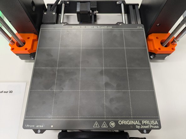Once you have removed your print and all remaining filament from the print surface you should return the print surface to the printer.