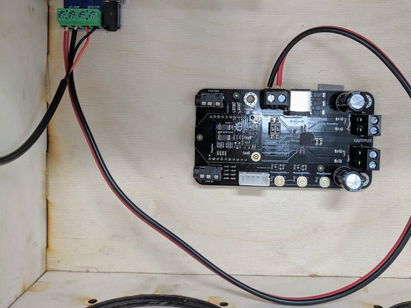 Now connect the  12&quot; length of black and red wire to the terminal block on the BT/amplifier board.  Use a screwdriver to close the terminal blocks on the wires.
