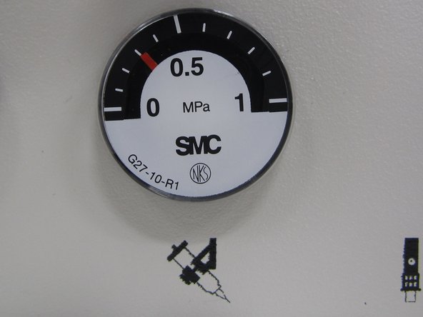 When you have the correct pressure, push the knob back in to lock in the pressure setting.  The orange ring should no longer be exposed when you are finished setting the pressure.