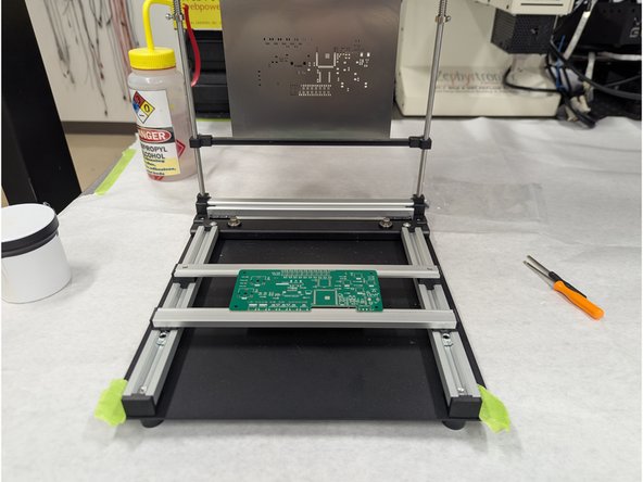 The stencil printer is set up already for the ECEG 201 project.  All you should need to do is carefully insert your blank PCB into the printer.