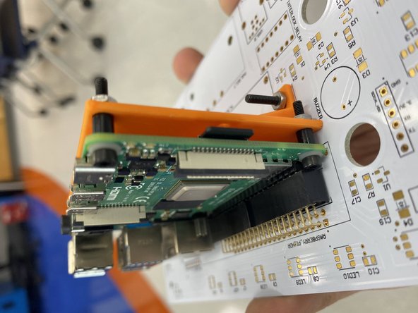 Secure the RPi onto the PCB using the M2.5 screws.