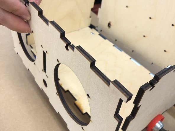 The rear wall of the speaker must have the hole for the power jack in the lower left-hand corner, as you face the front of the box.    That is, there is only one way that this segment can face.