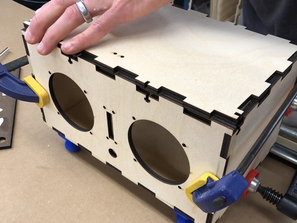 Place DO NOT GLUE the top of the box on the top of the box.  This helps ensure the other pieces maintain the correct spacing.