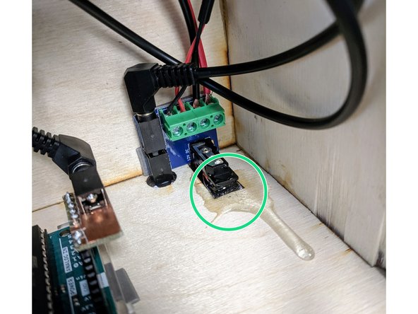 (31) While you have the epoxy handy, we found it was helpful to shore up the power switch with a dab of epoxy to adhere the switch module to the box.