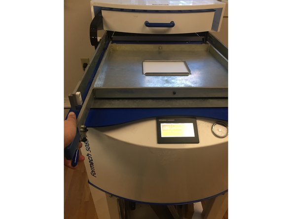 Now that the object is lowered and in place, we are going to place the plastic sheet we just cut over the inner rectangle of the bottom frame.