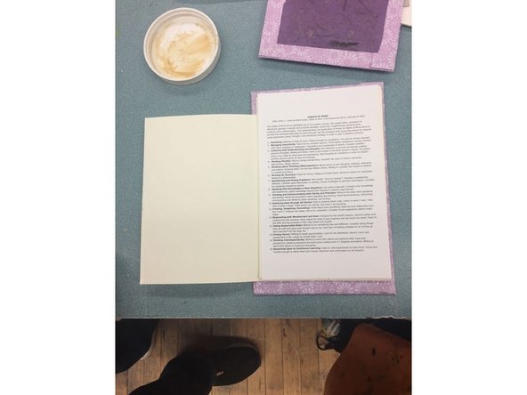 Place your papers between the two covers and align them the way you want them to look.