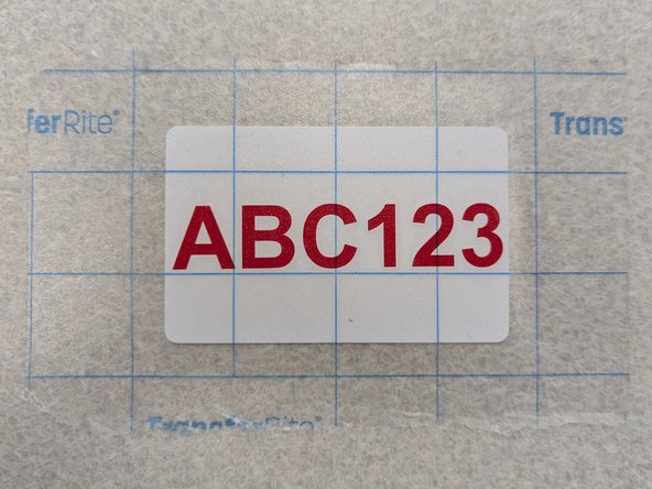 Carefully peel the transfer tape off of the white backing.  The vinyl decal should come with it.  If the decal does not lift with the transfer tape, pause and lay the tape back down.  Reapply uniform pressure with the white squeegee to ensure the transfer tape is firmly pressed against the decal.