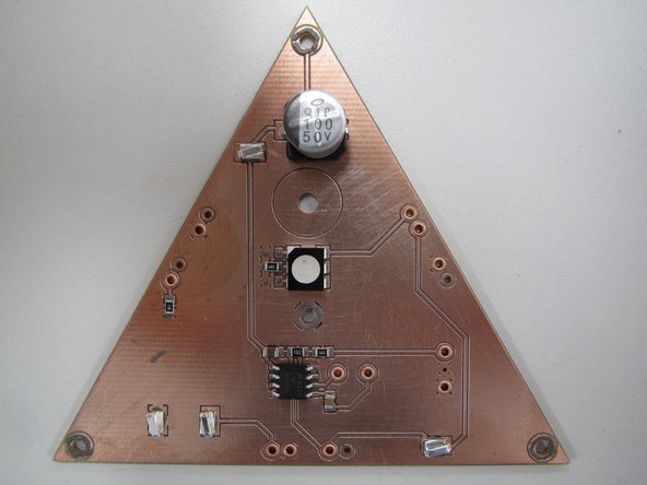 After you have placed all of your components, move the handrest to the right and carefully loosen the thumbscrew securing your PCB in place.  Gently lift your PCB out of the cradle.