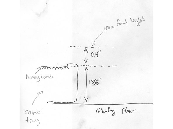The surface of the crumb tray is 1.368 inches above the silver floor of the Glowforge when the crumb tray is removed.