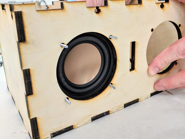 Select eight 4-40 3/4&quot; philips screws, eight washers, and eight nuts from the supplies provided.  You will use  four of each to fasten each speaker to the front panel of the box.