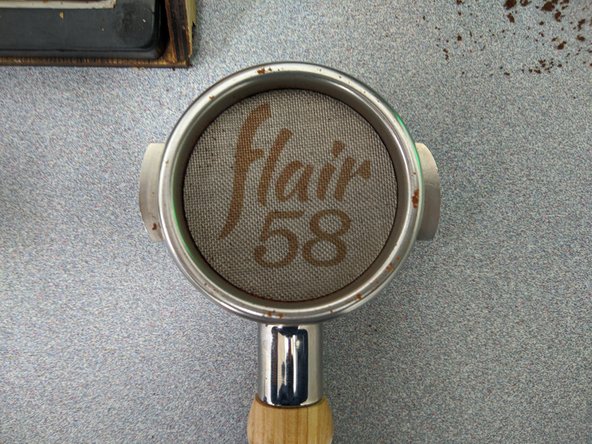 Now that your grounds are tamped, be sure to add the Flair puck screen on top of your puck.