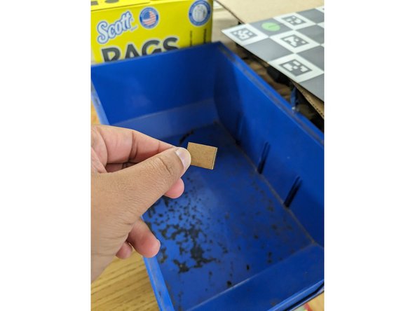 Small pieces can be discarded in the blue bin on top of the scrap materials or the recycling bin.