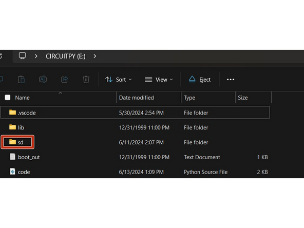 In the location where code.py is stored on your Feather M4, create a folder named sd.