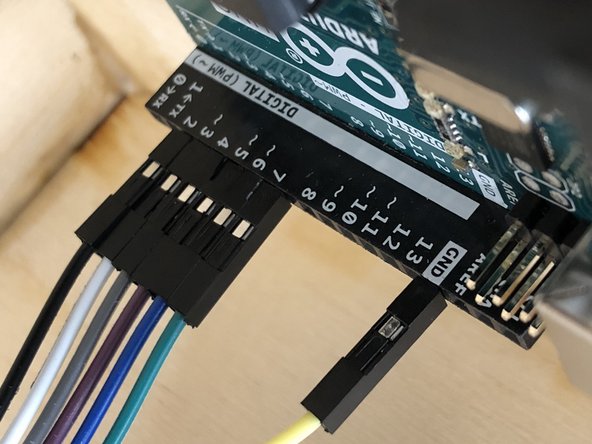 The top wire should connect to the &quot;Ground&quot; (labeled GND) terminal hole.