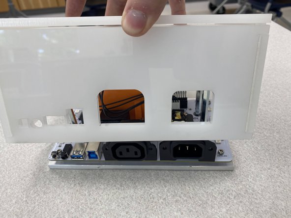 Take the enclosure and slowly and gently place it over the entire setup, making sure to keep the wires inside the box.