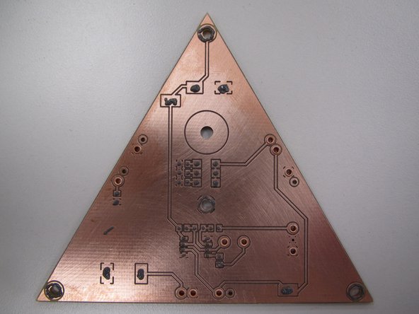 When you have paste applied to all of your SMT pads, as well as the spring pin rings, your board should look similar to this example.