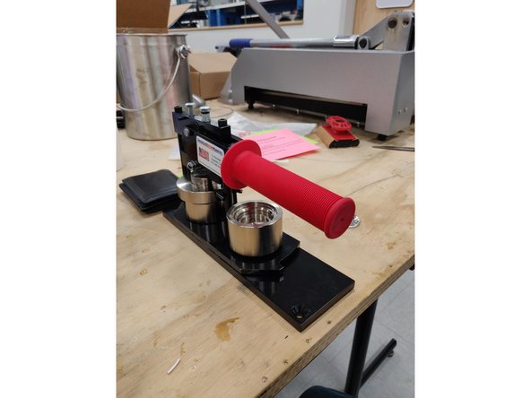 Pull the lever all the way down towards you. It should be horizontal with the table.