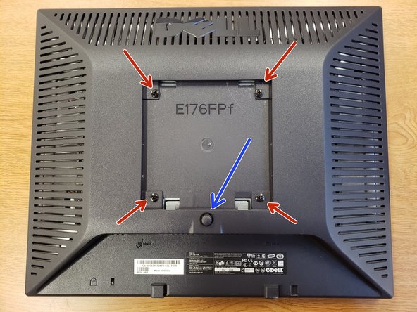 Press the black button and pull the base away from the monitor screen.