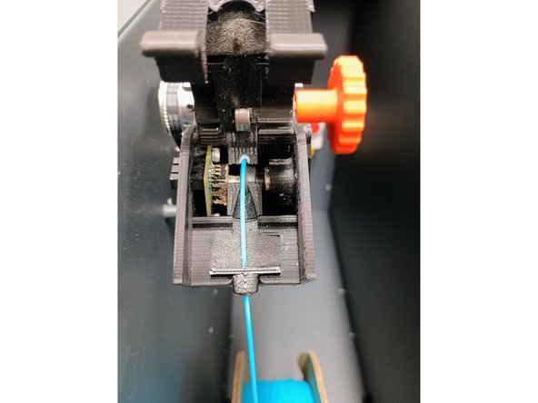 Pull tabs (red arrow) revealing internal area.