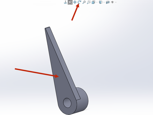 Use the Rotate tool to drag and rotate the arm so that you can view the flat, top face.