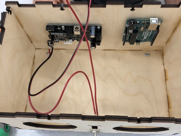 Attach the Arduino on the inside of the  speaker box.  It fits on the right-hand side (while facing the front of the box) on the back wall with the USB port facing up.