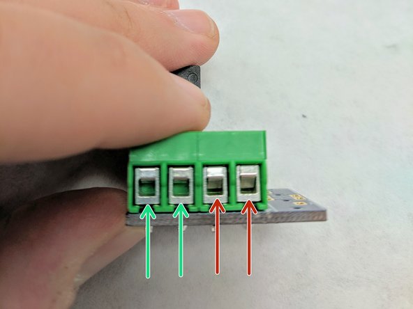 (10)Look at the front (square holes) of the green terminal blocks and ensure that the blocks are open. In the picture, the left blocks are open and the right blocks are not.