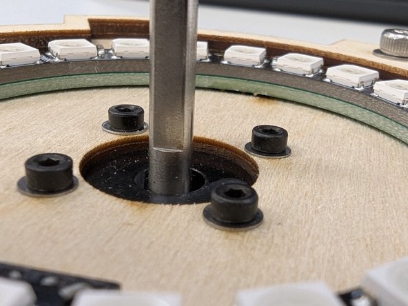 Locate the NeoPixel ring and flip it over so you see the three pin connector.  You'll need to insert this connector into the corresponding connector on the left of your PCB assembly, highlighted here in green.