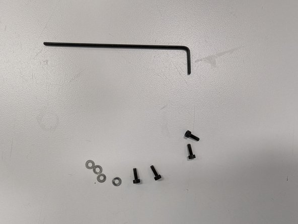 Locate the four M2 bolts, four M2 washers, and smaller of the two hex keys.