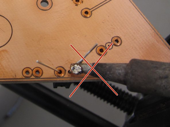 The key to good soldering is proper heat transfer.  Solder will never melt if heat does not transfer properly from the tip of the iron to the component(s) being soldered.